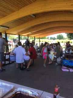 Group picture of people eating at the NALC Picnic 2016